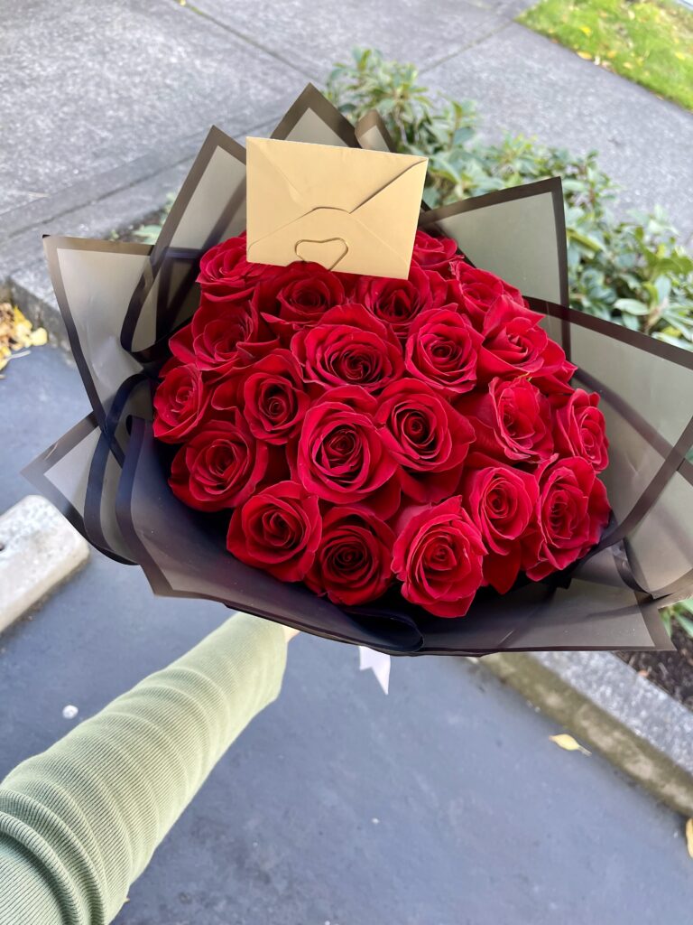 Timeless Rose Wrap with premium red roses in elegant black wrapping by a Santa Monica florist